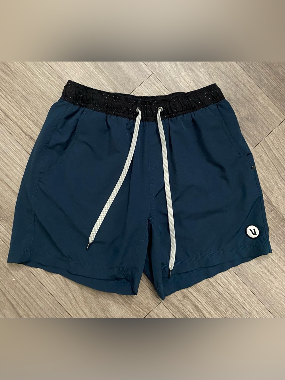 Vuori Deep Teal Athletic Shorts with Black Waistband and White Drawcords